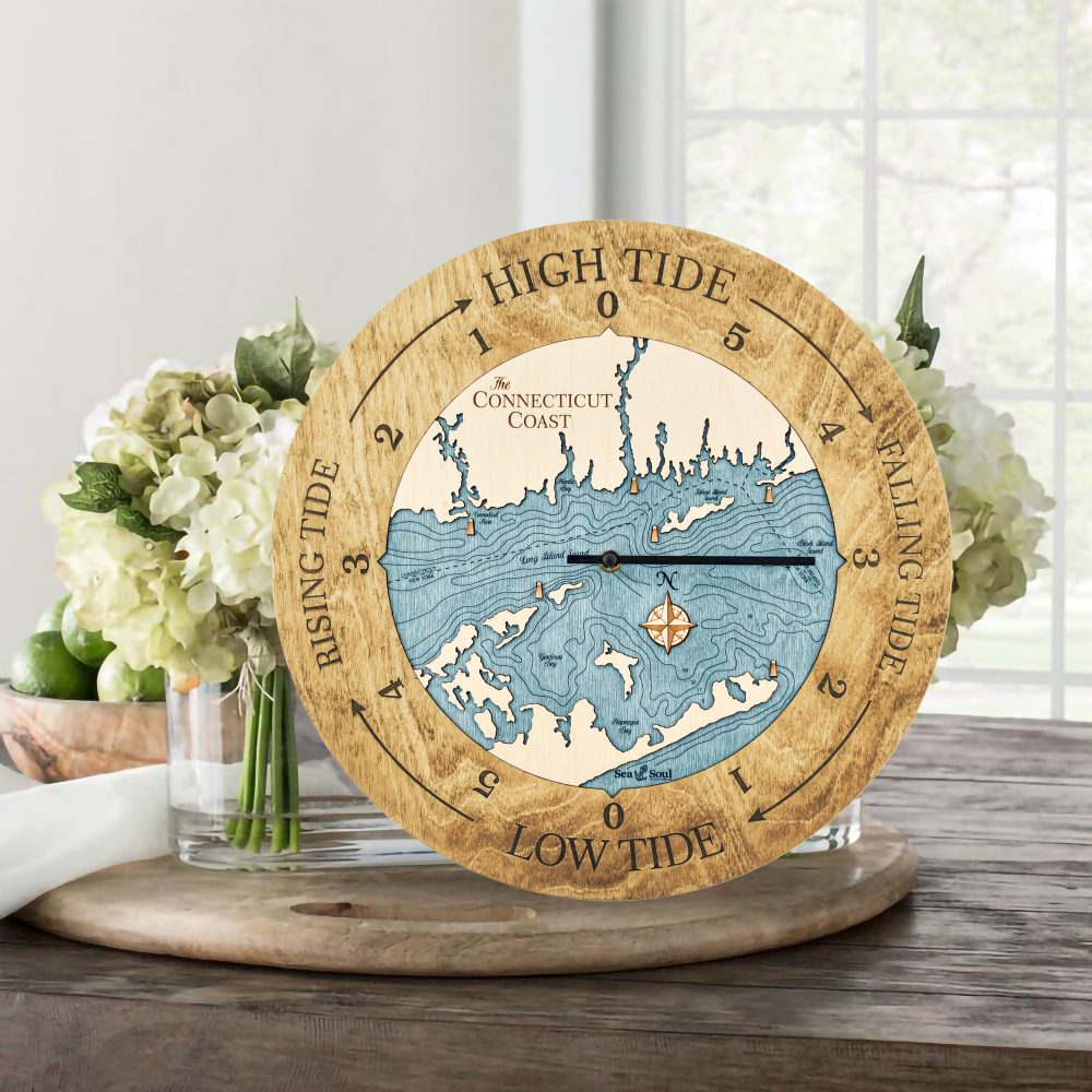Connecticut Coast Tide Clock Honey Accent with Blue Green Water Sitting on Table with Flowers