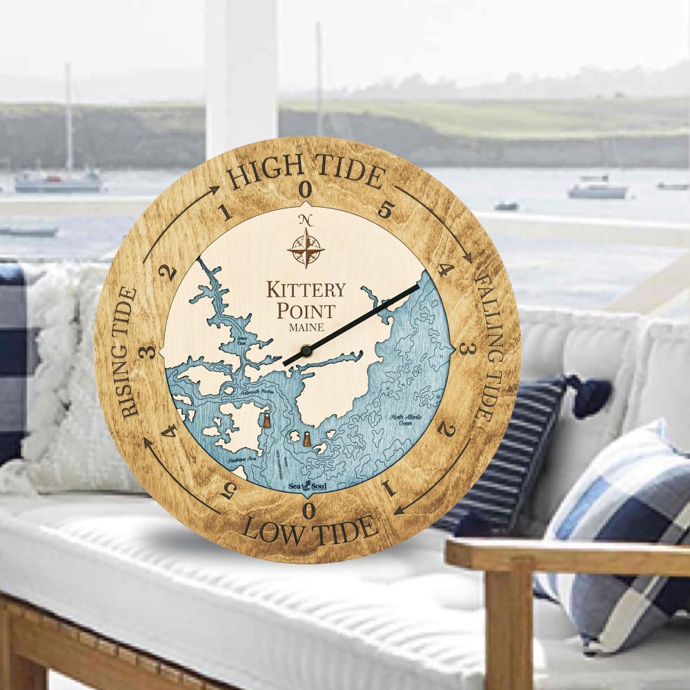 Kittery Point Tide Clock Honey Accent with Blue Green Water Sitting on Outdoor Couch by Waterfront