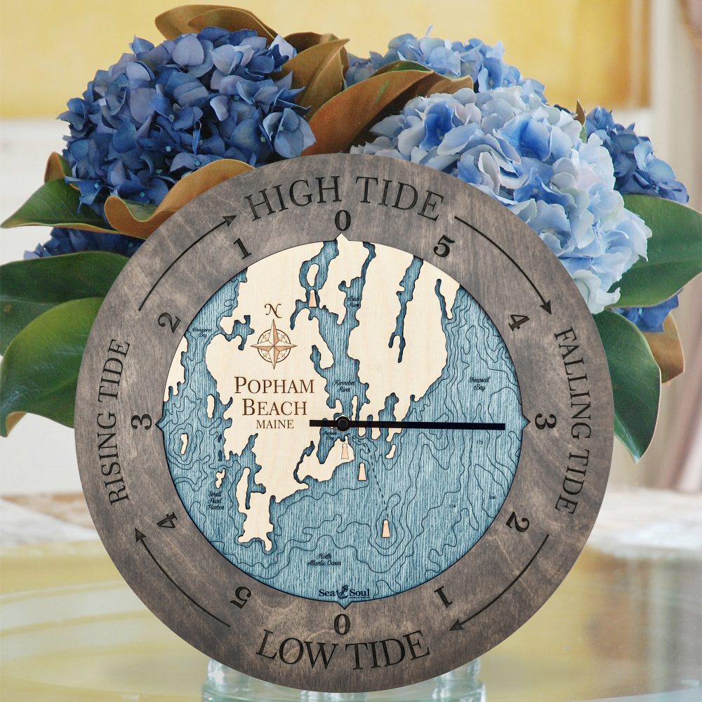 Popham Beach Tide Clock Driftwood Accent with Blue Green Water Sitting on Table with Flowers