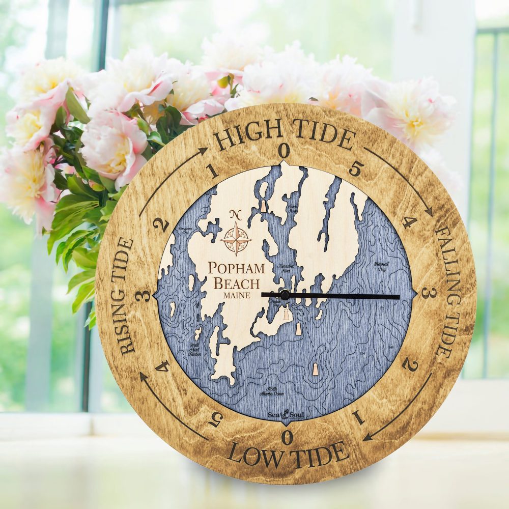 Popham Beach Tide Clock Honey Accent with Deep Blue Water Sitting on Windowsill with Flowers