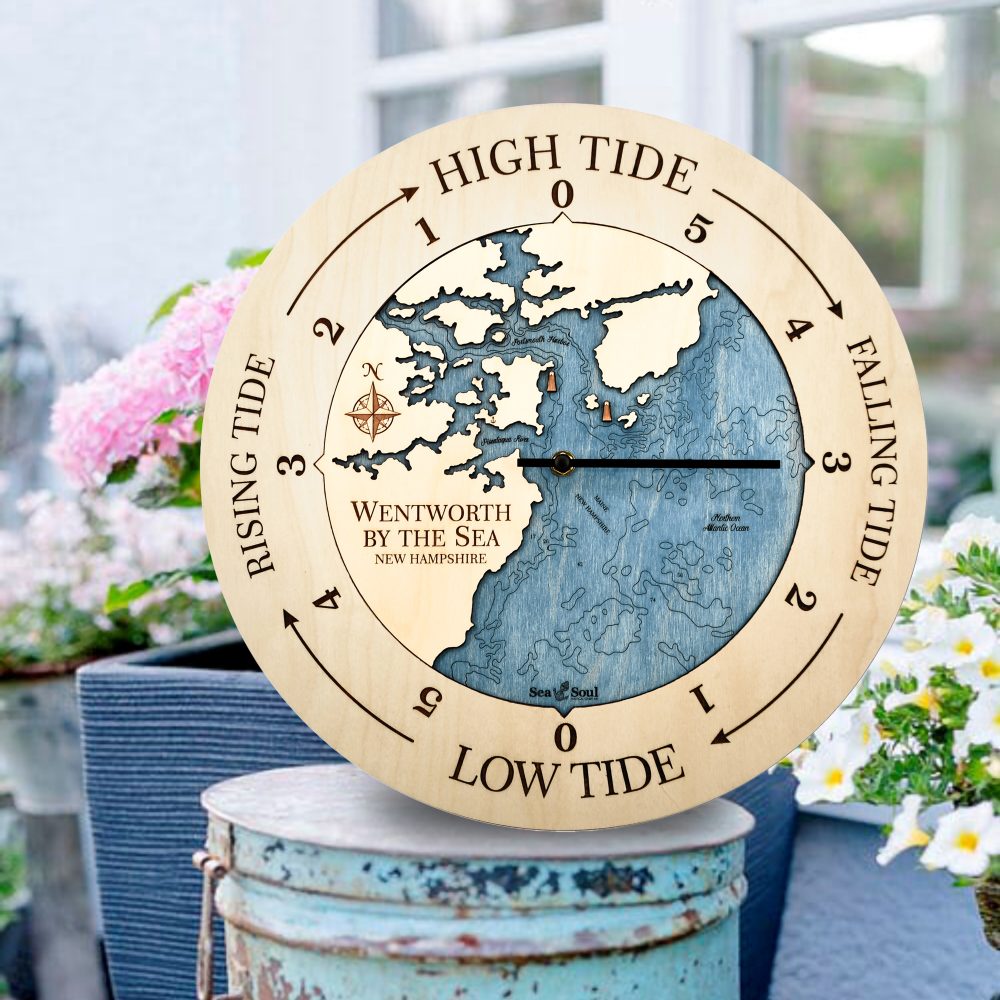 Wentworth New Hampshire Tide Clock Birch Accent with Deep Blue Water Sitting on Bucket Outdoors by Flowers