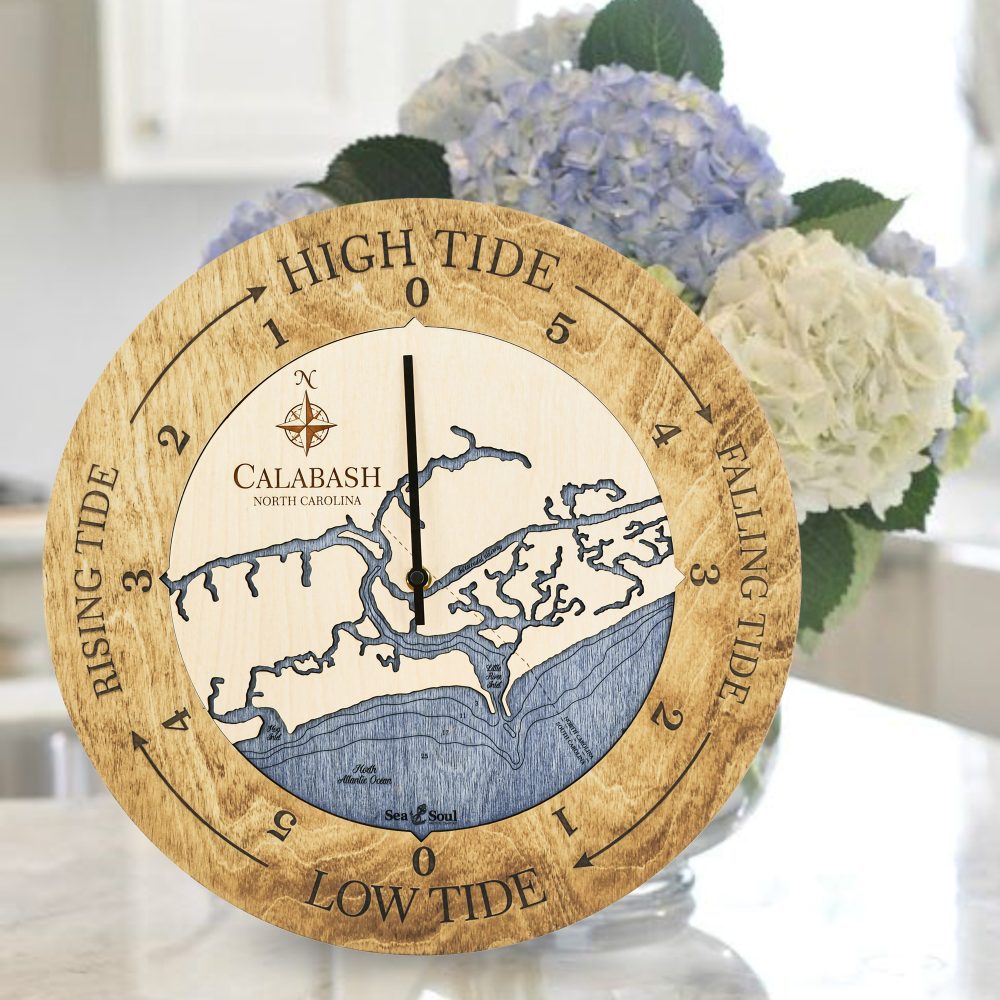 Calabash Tide Clock Honey Accent with Deep Blue Water Sitting on Countertop with Flowers