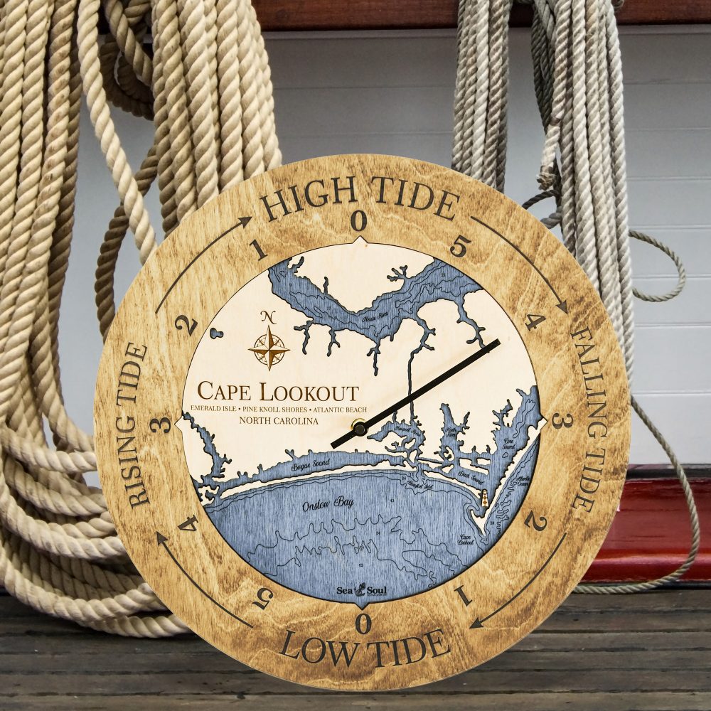 Cape Lookout Tide Clock Honey Accent with Deep Blue Water Sitting on Ground by Boat