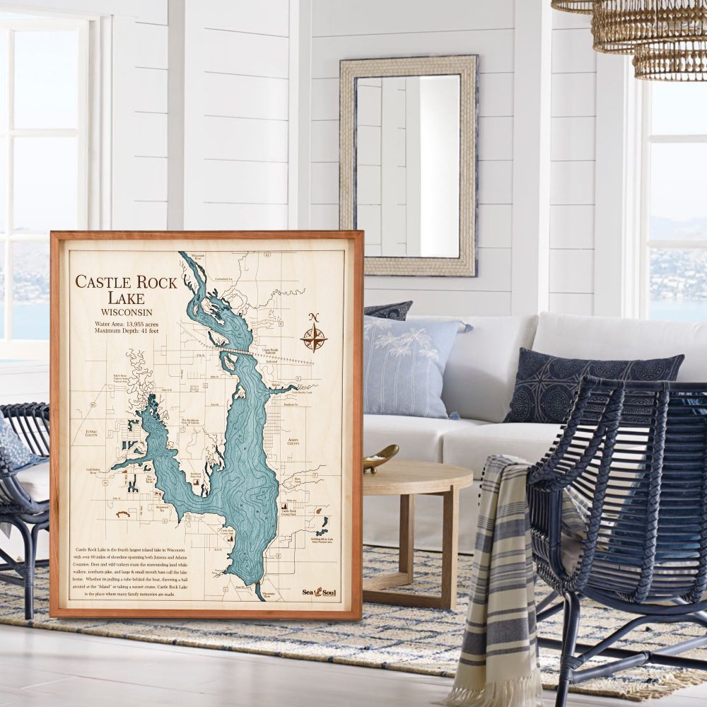 Castle Rock Nautical Map Wall Art Cherry Accent with Blue Green Water Sitting in Living Room by Chair and Coffee Table