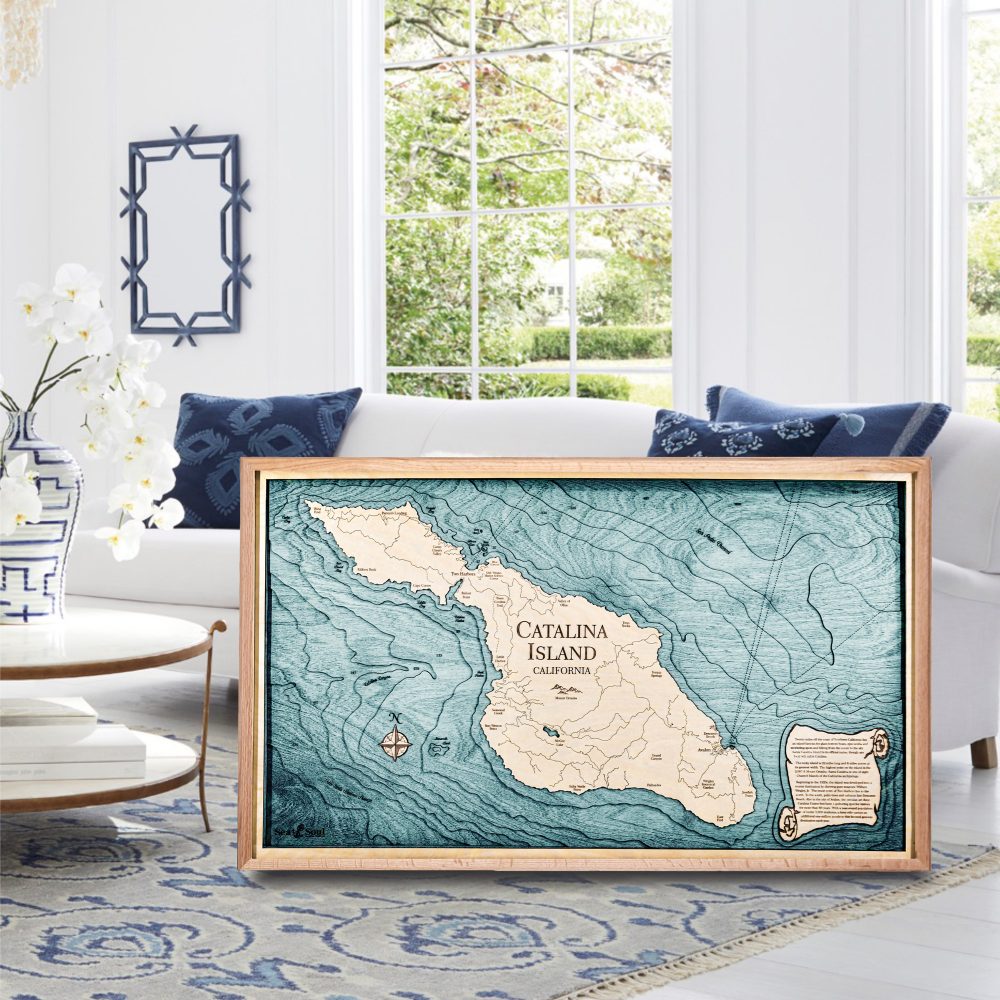 Catalina Island Nautical Map Wall Art Oak Accent with Blue Green Water Sitting on Floor in Living Room by Coffee Table