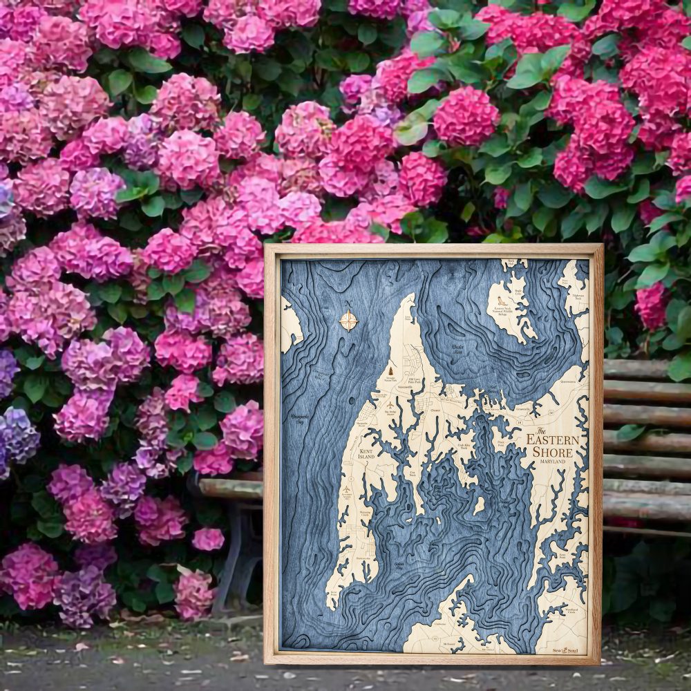 Eastern Shore Nautical Map Wall Art Oak Accent with Deep Blue Water Sitting on Ground by Bench and Flowers