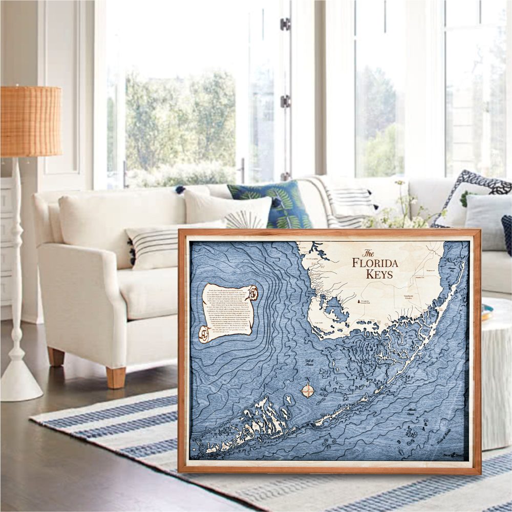 Florida Keys Nautical Map Wall Art Cherry Accent with Deep Blue Water Sitting on Living Room Floor by Couch and Coffee Table