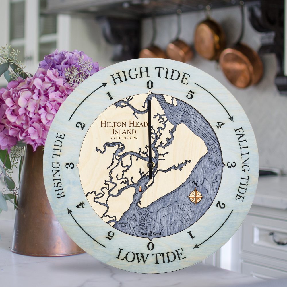 Hilton Head Island Tide Clock Bleach Blue Accent with Deep Blue Water Sitting on Countertop with Flowers