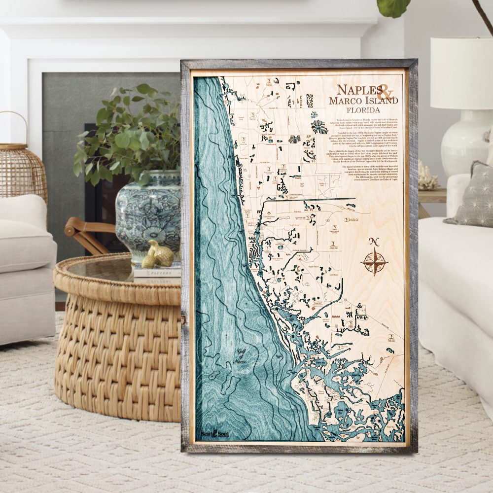 Naples Nautical Map Wall Art Rustic Pine Accent with Blue Green Water Sitting on Living Room Floor by Coffee Table