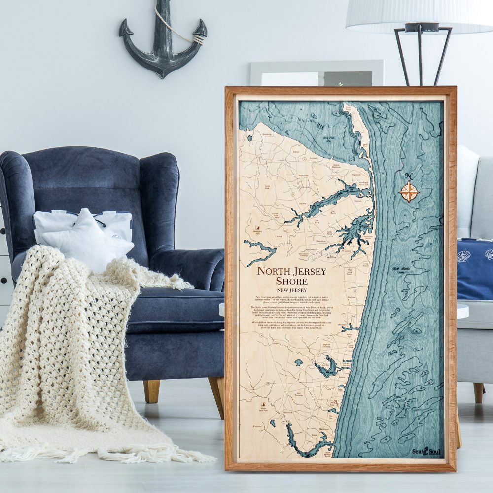 North Jersey Nautical Map Wall Art Cherry Accent with Blue Green Water Sitting on the Living Room Floor by Armchair