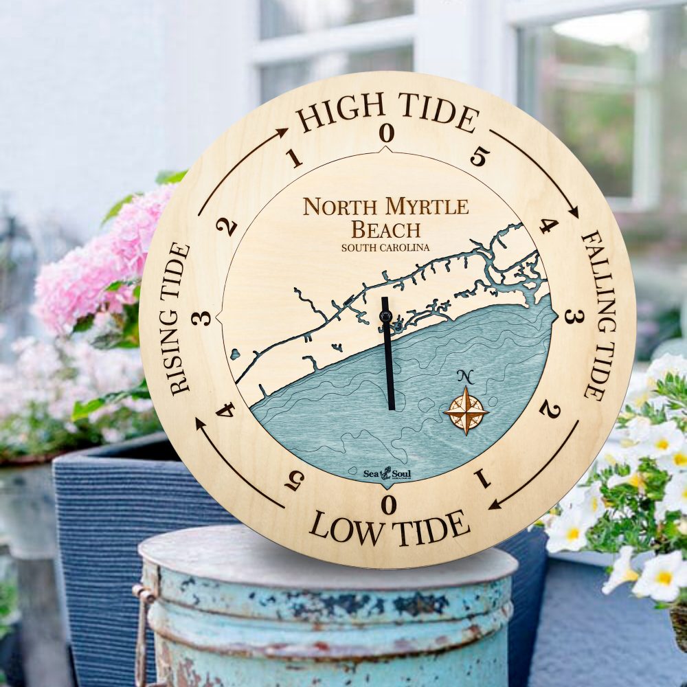 North Myrtle Beach Tide Clock Birch Accent with Blue Green Water Sitting on Bucket Outdoors by Flower Pot
