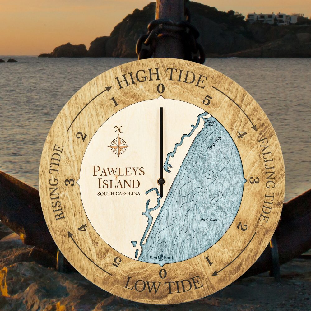 Pawleys Island Tide Clock Honey Accent with Blue Green Water Sitting on Ground by Anchor and Waterfront
