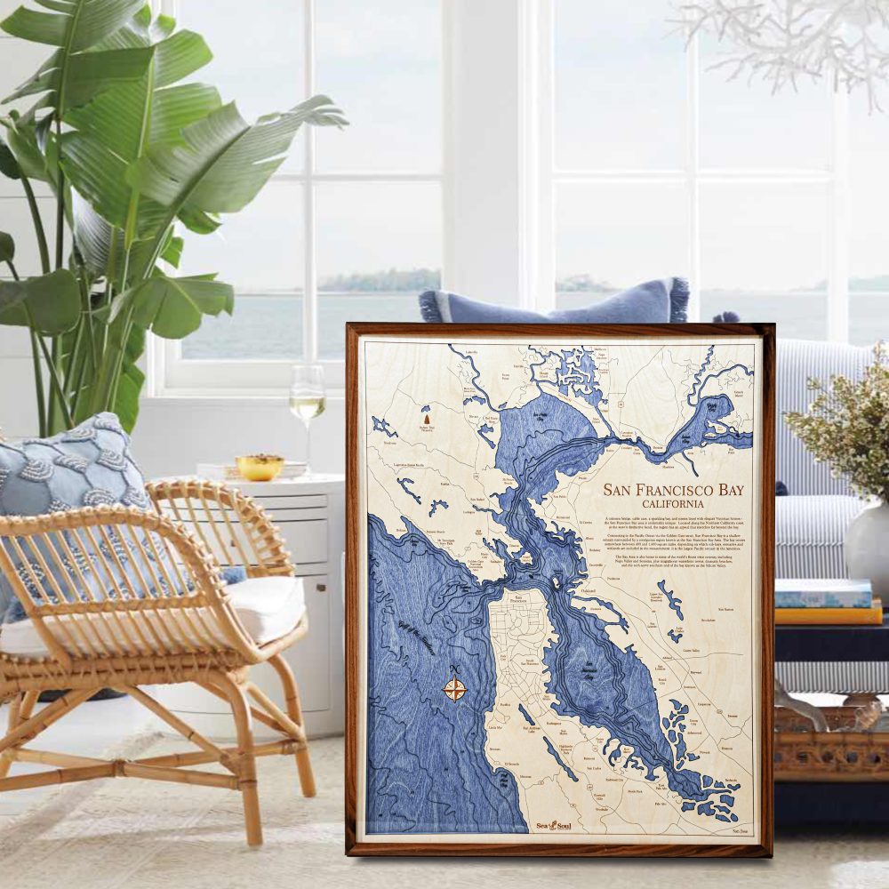 San Francisco Nautical Map Wall Art Walnut Accent with Deep Blue Water Sitting on Living Room Floor by Armchair and Coffee Table