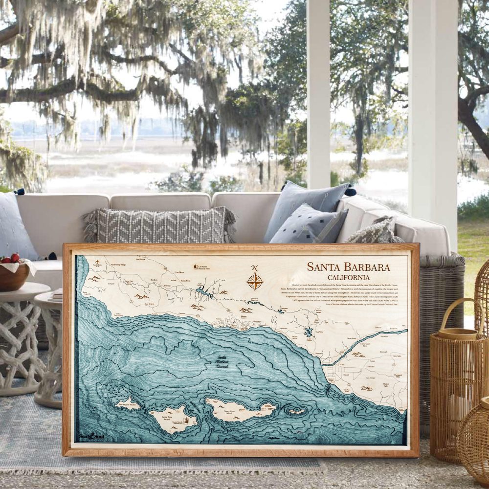 Santa Barbara Nautical Map Wall Art Cherry Accent with Blue Green Water Sitting on Ground by Outdoor Couch on Porch