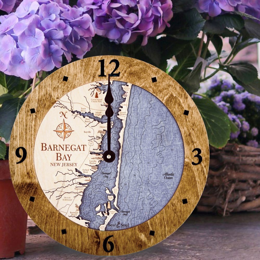 Barnegat Bay Nautical Map Wall Clock Americana Accent with Deep Blue Water Sitting on Ground Outside by Flowers