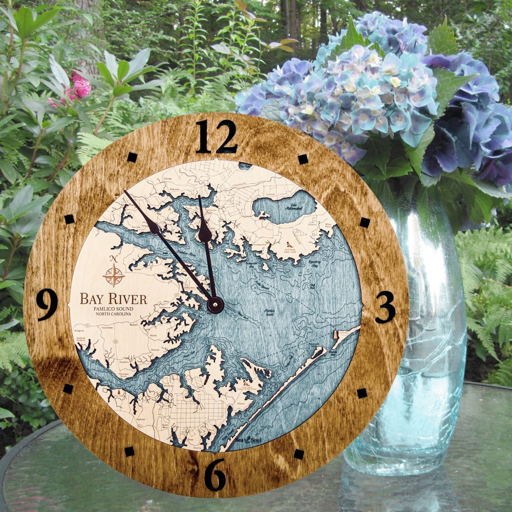 Bay River Nautical Map Clock Americana Accent with Blue Green Water Sitting on Outdoor Table with Flowers