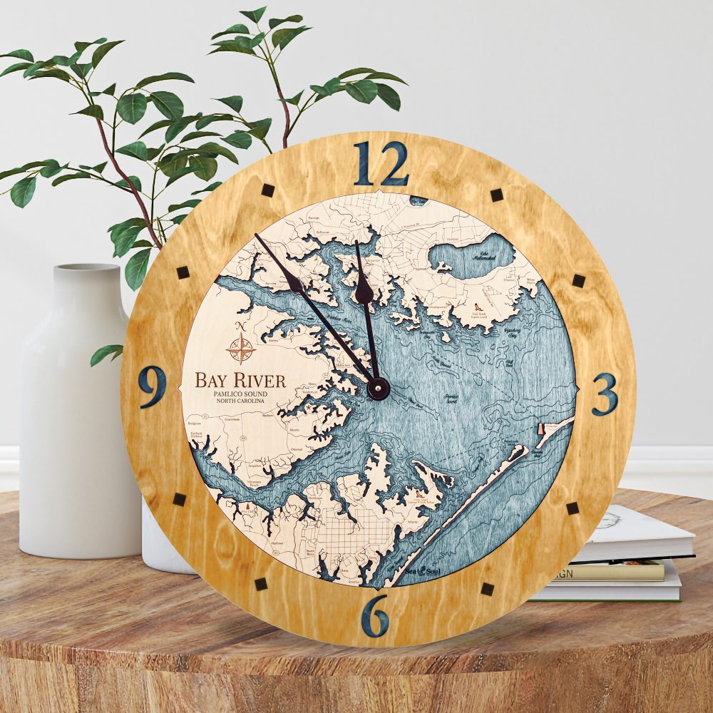 Bay River Nautical Clock Honey Accent with Blue Green Water Sitting on Coffee Table by Books and Flowers