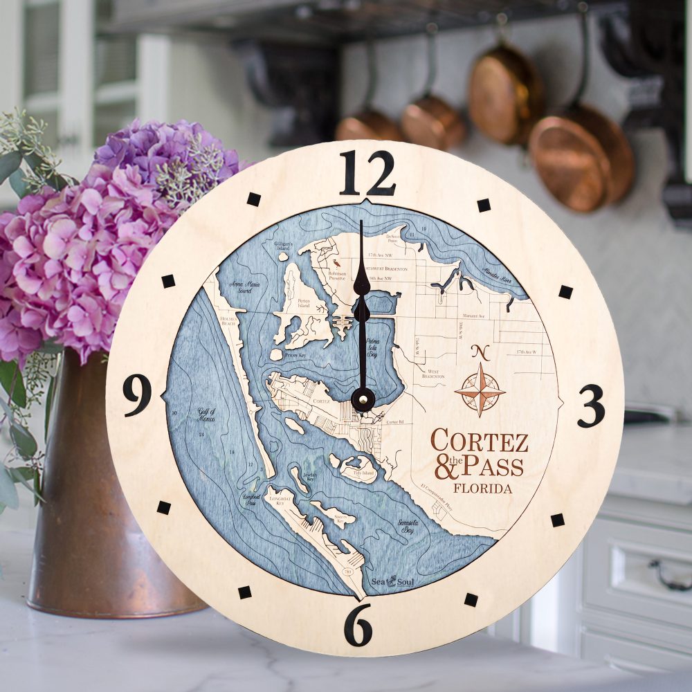 Cortez and Pass Nautical Map Wall Art Birch Accent with Deep Blue Water Sitting on Countertop by Flowers