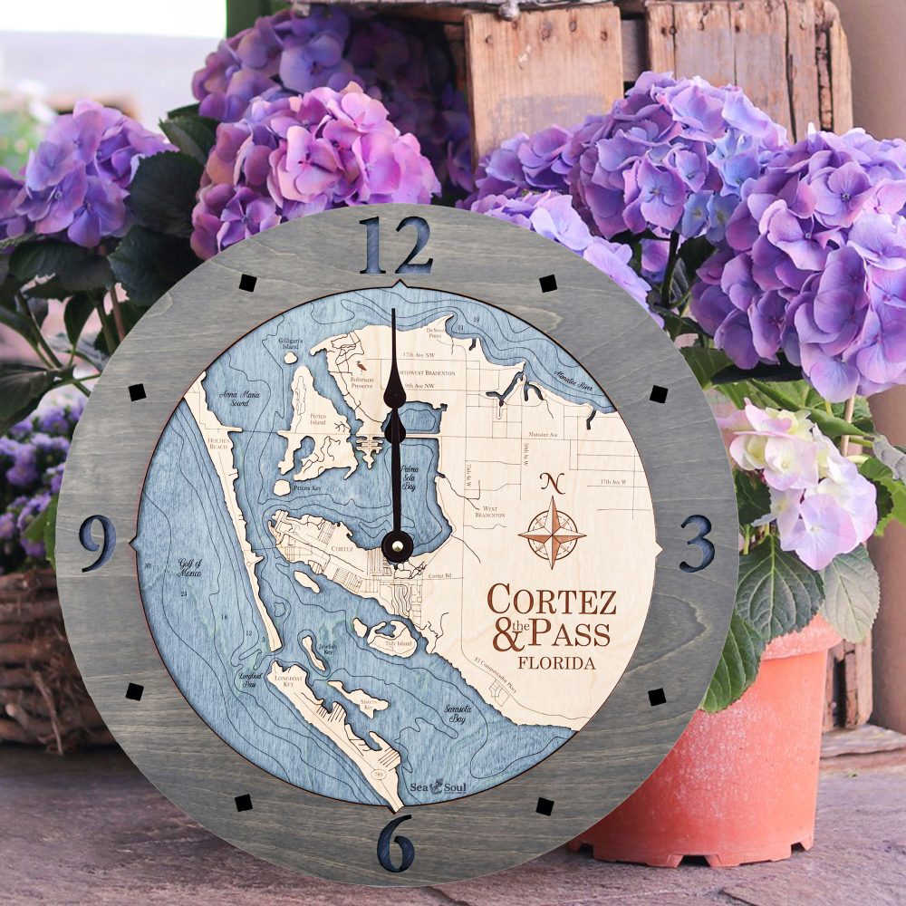 Cortez and Pass Nautical Map Wall Art Driftwood Accent with Deep Blue Water Sitting on Ground by Flowers