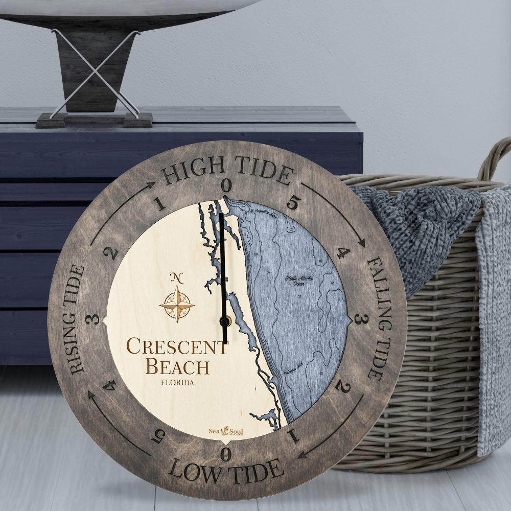Crescent Beach Tide Clock Driftwood Accent with Deep Blue Water Sitting on Ground by Basket