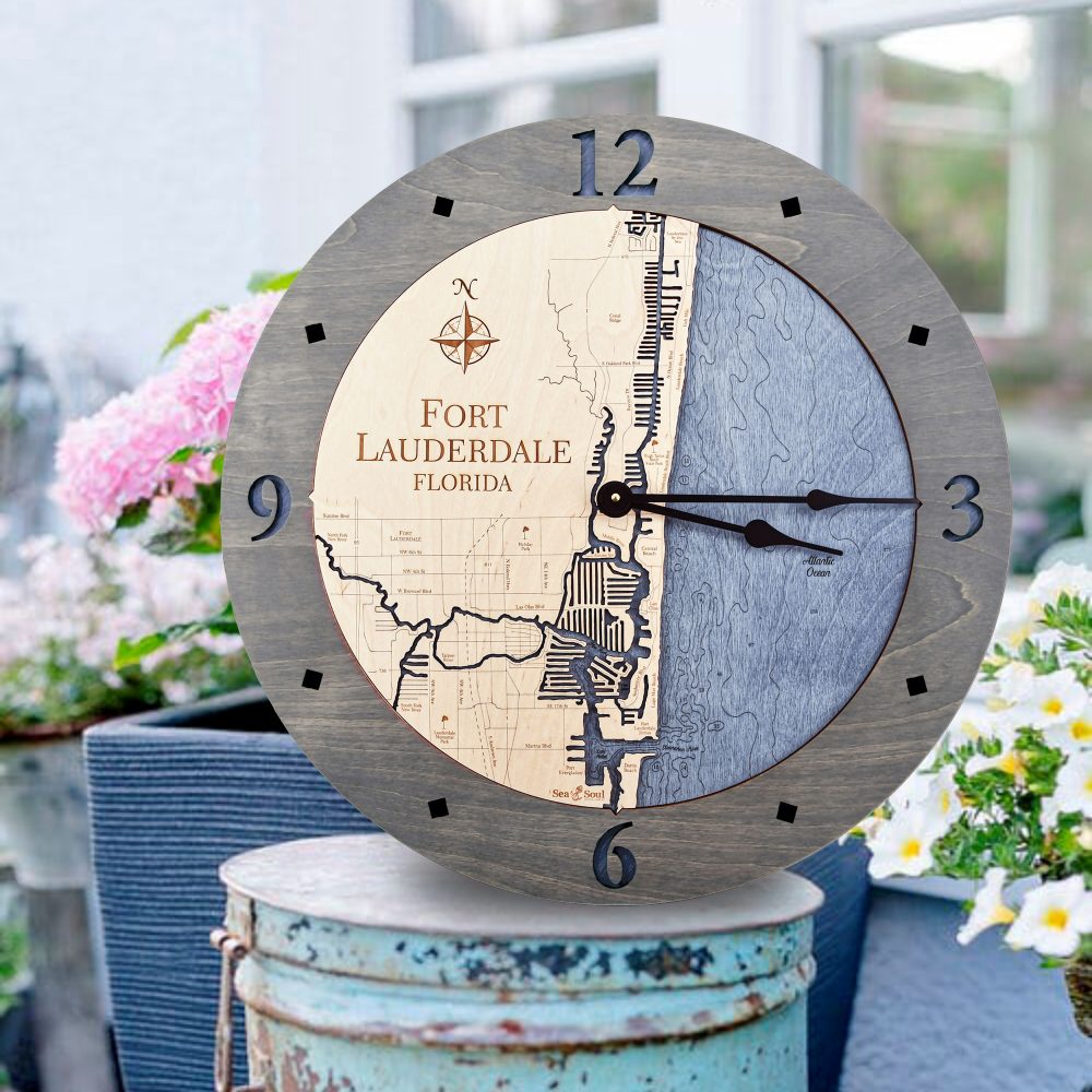 Fort Lauderdale Nautical Map Wall Art Driftwood Accent with Deep Blue Water Sitting on Bucket Outdoors by Flowers