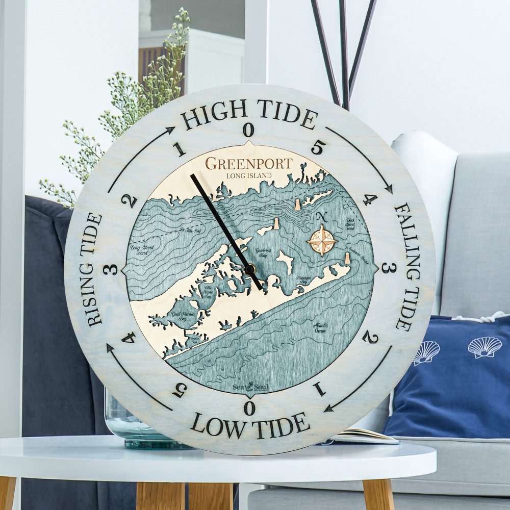 Greenport Tide Clock Bleach Blue Accent with Blue Green Water Sitting on Coffee Table