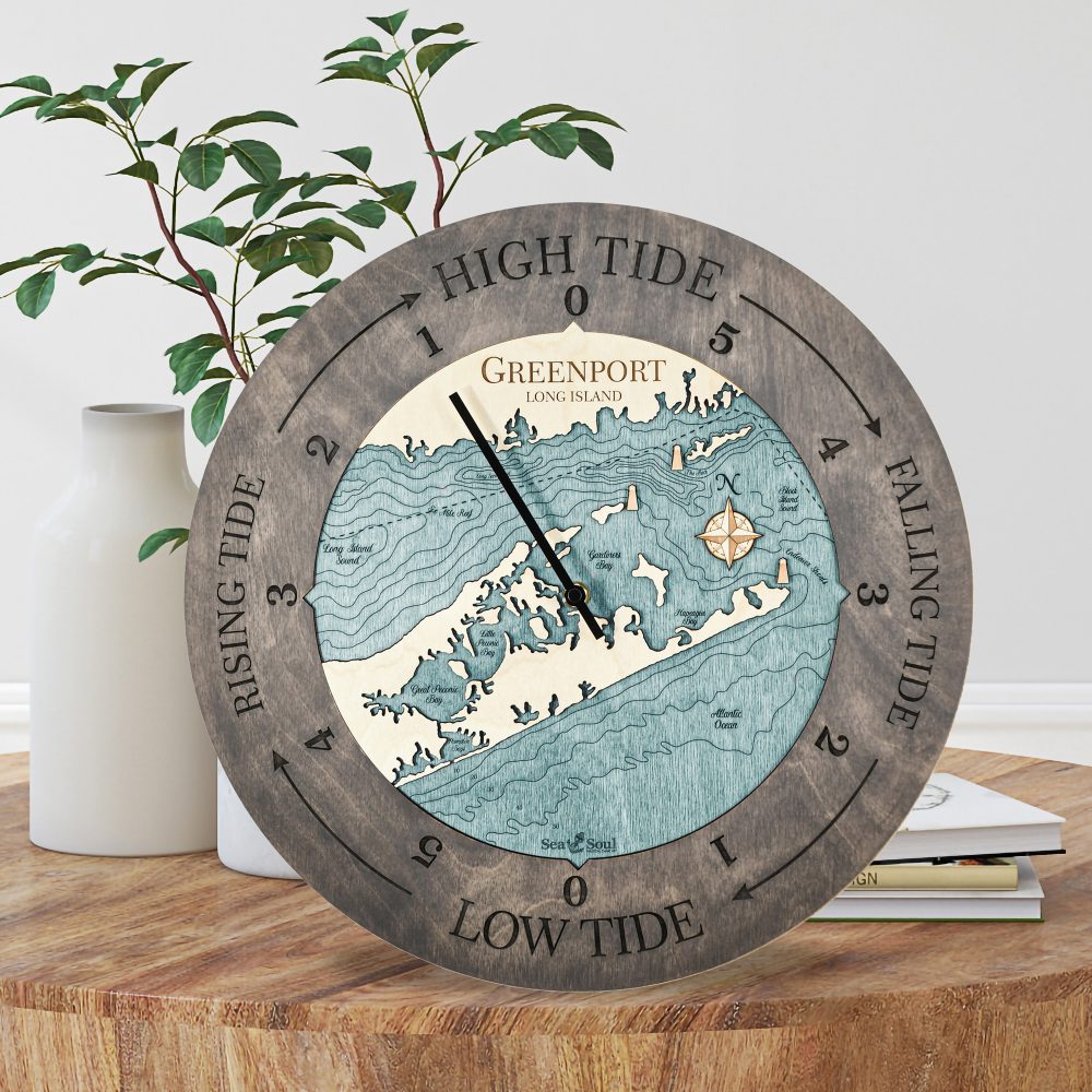 Greenport Tide Clock Driftwood Accent with Blue Green Water Sitting on Coffee Table by Books and Vases