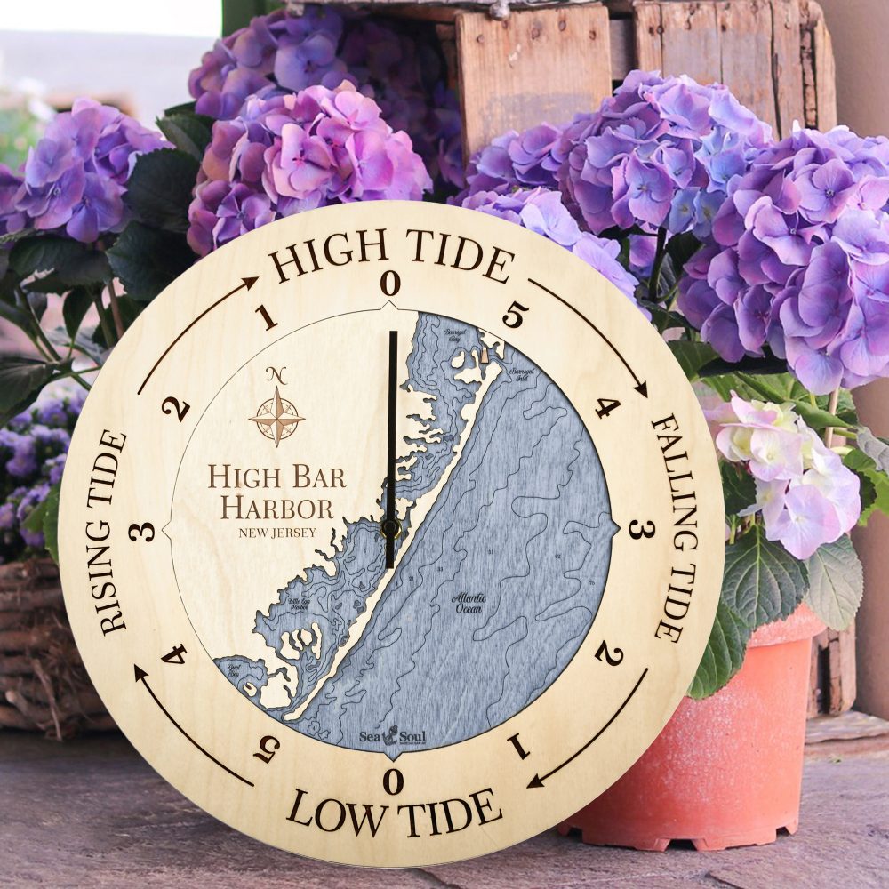 High Bar Harbor Tide Clock Birch Accent with Deep Blue Water Sitting on Ground by Flower Pots