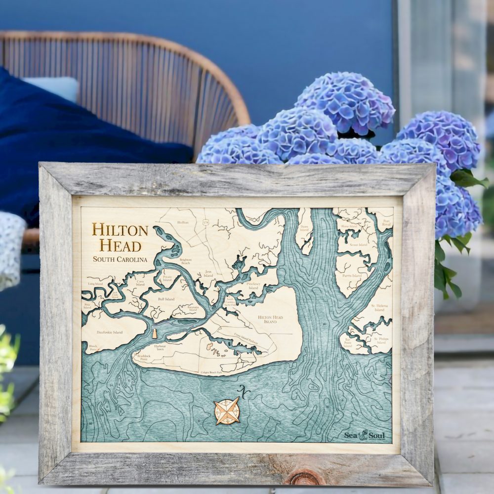 Hilton Head Nautical Map Wall Art Rustic Pine Accent with Blue Green Water Sitting by Flower Pot on Porch
