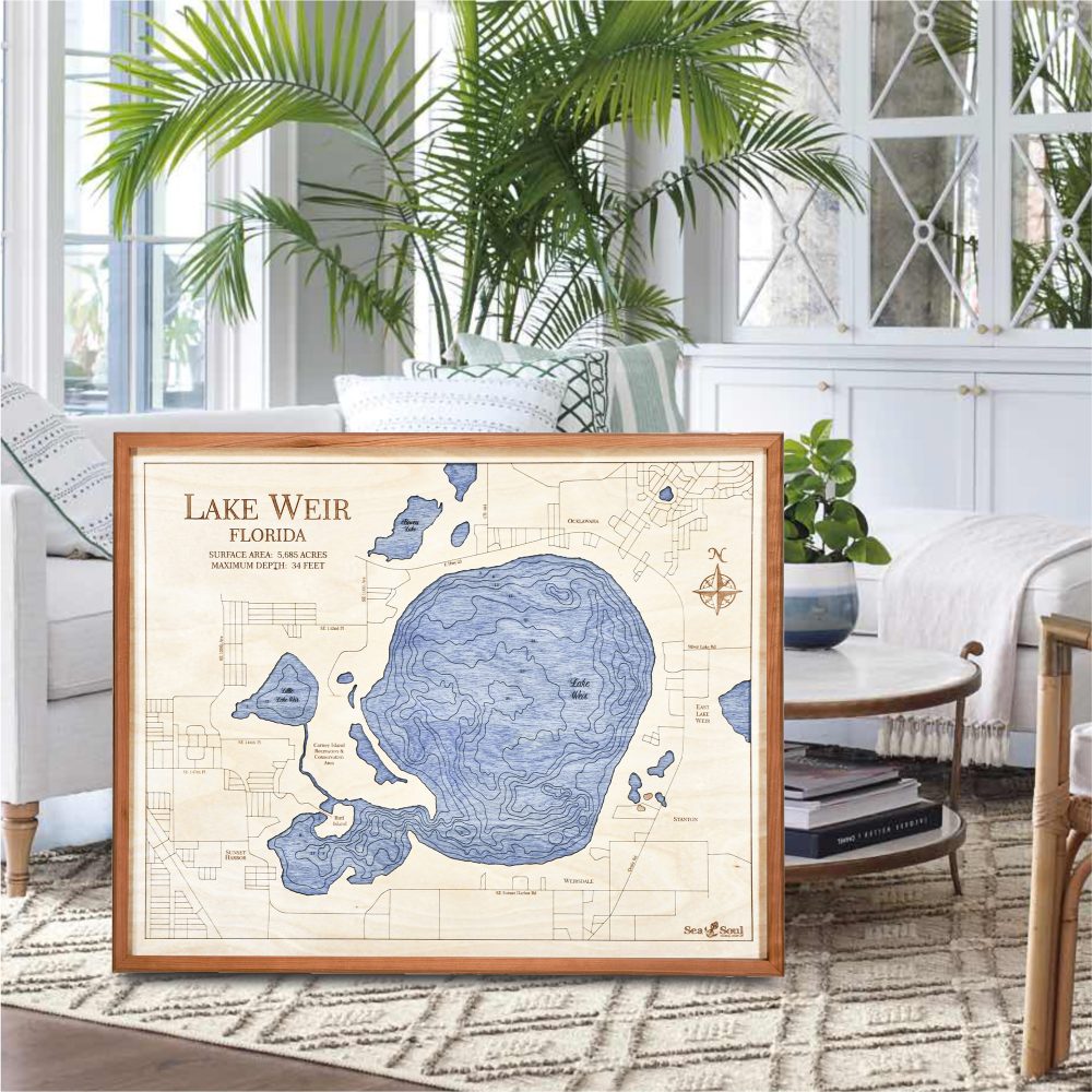 Lake Weir Nautical Map Wall Art Cherry Accent with Deep Blue Water Sitting in Living Room by Coffee Table and Couch
