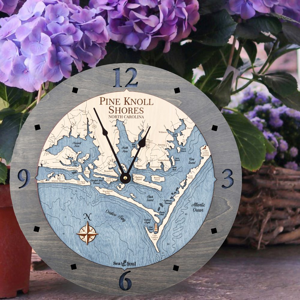 Pine Knoll Shores Nautical Wall Clock Driftwood Accent with Deep Blue Water Sitting on Ground by Flower Pots
