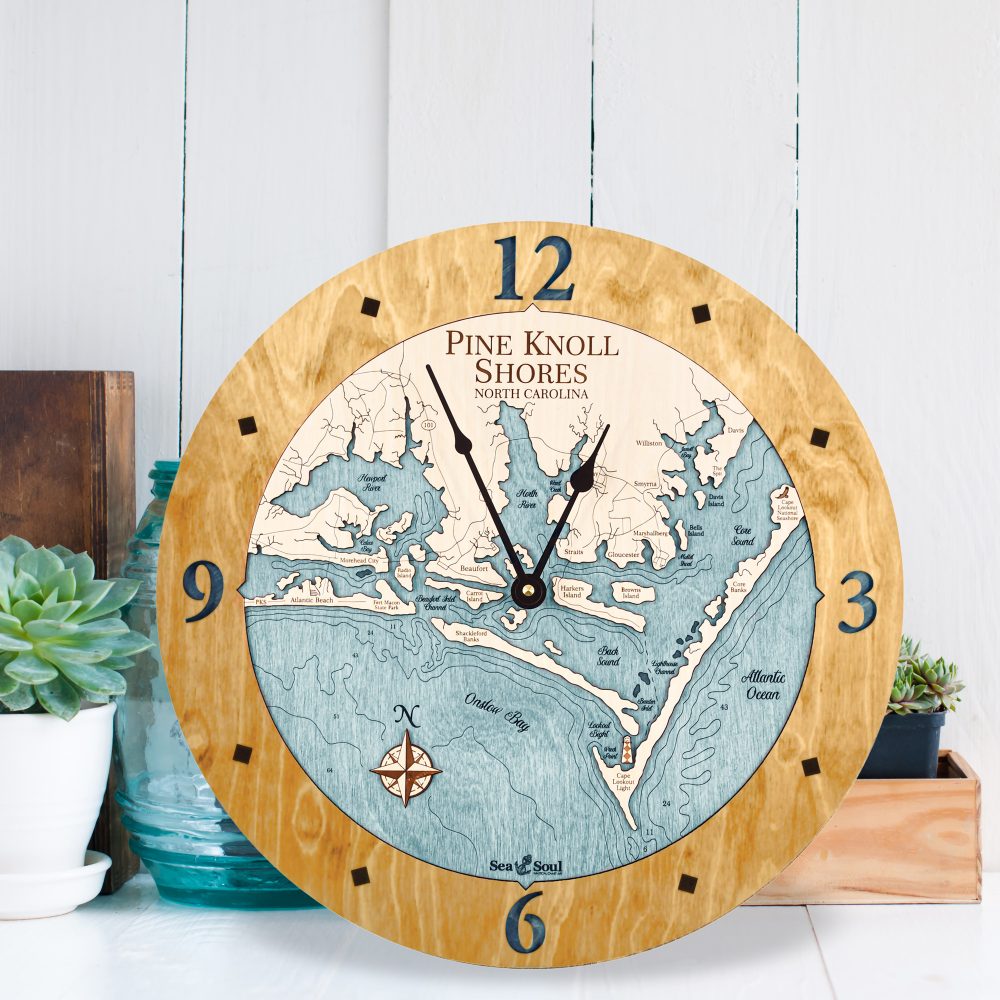 Pine Knoll Shores Nautical Wall Clock Honey Accent with Blue Green Water Sitting by Succulents