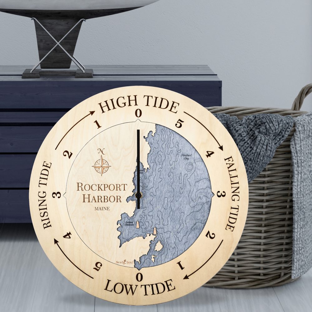 Rockport Harbor Tide Clock Birch Accent with Deep Blue Water Sitting on Ground by Basket