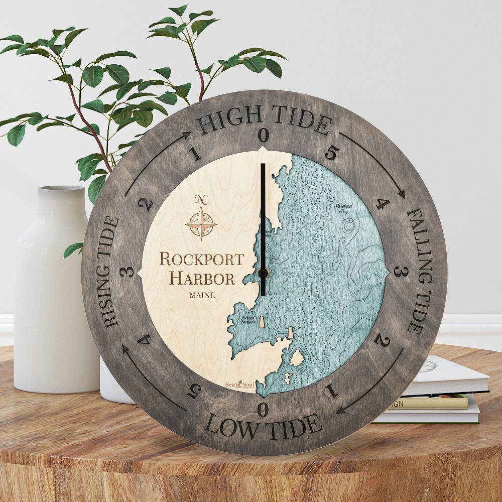 Rockport Harbor Tide Clock Driftwood Accent with Blue Green Water Sitting on Coffee Table by Books and Vases