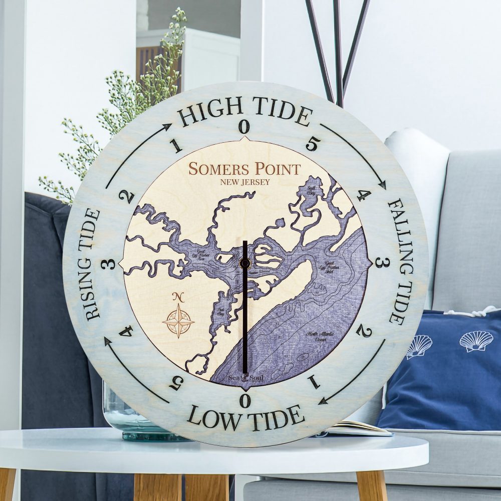 Somers Point Tide Clock Bleach Blue Accent with Deep Blue Water Sitting on Coffee Table