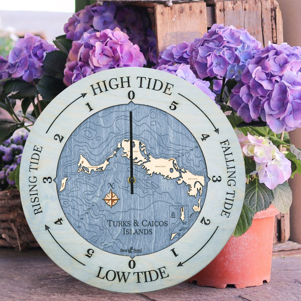 Turks and Caicos Tide Clock Bleach Blue Accent with Deep Blue Water Sitting on Ground by Flower Pots