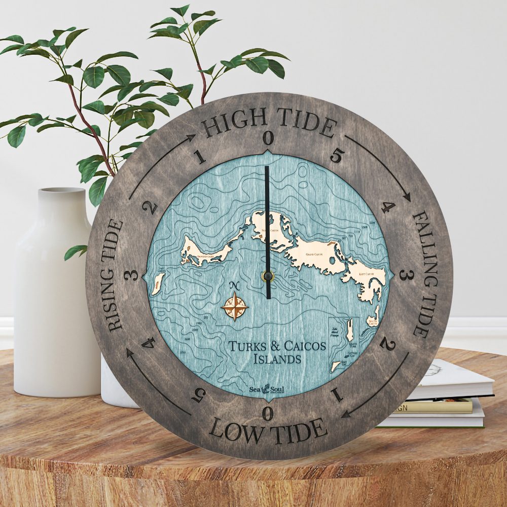 Turks and Caicos Tide Clock Driftwood Accent with Blue Green Water Sitting on Coffee Table by Books and Vases