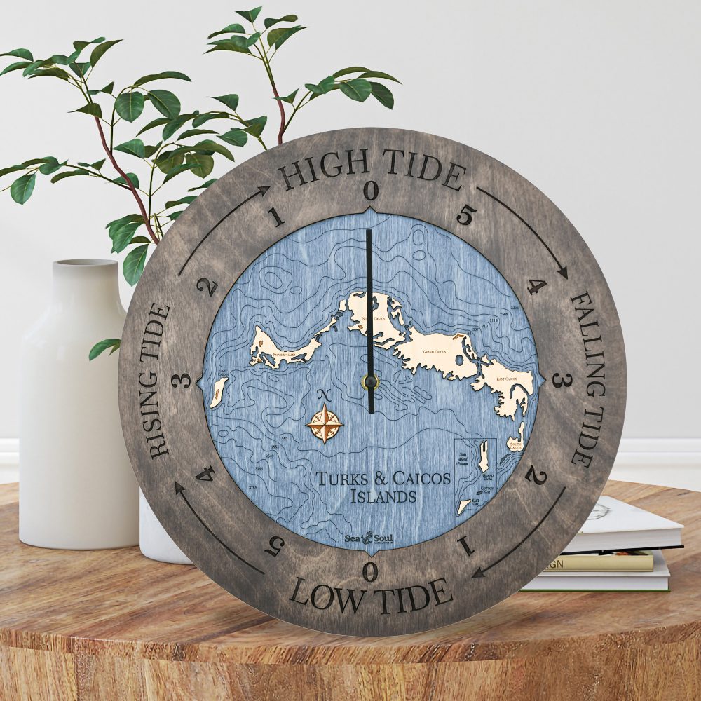 Turks and Caicos Tide Clock Driftwood Accent with Deep Blue Water Sitting on Coffee Table by Books and Vases