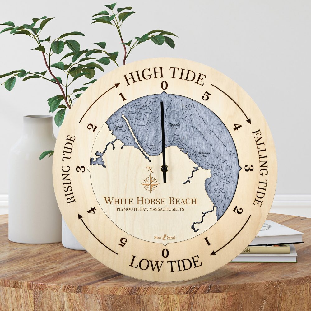 White Horse Beach Tide Clock Birch Accent with Deep Blue Water Sitting on Coffee Table by Books and Vases