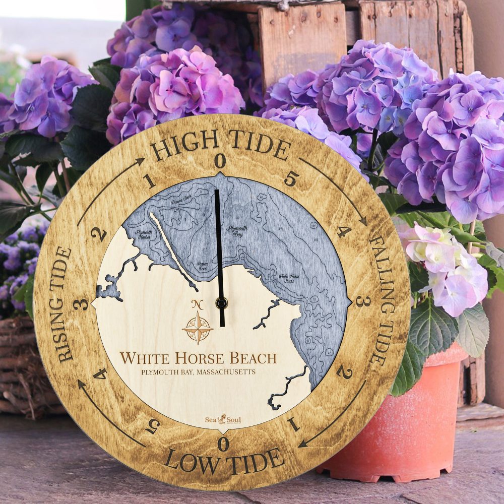 White Horse Beach Tide Clock Honey Accent with Deep Blue Water Sitting on Ground by Flower Pots