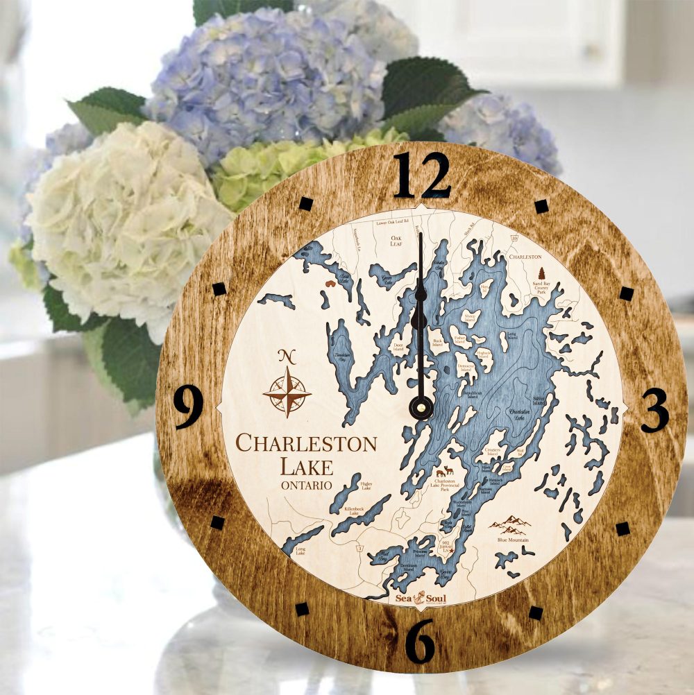 Charleston Lake Nautical Clock Americana Accent with Deep Blue Water Sitting on Countertop by Flowers