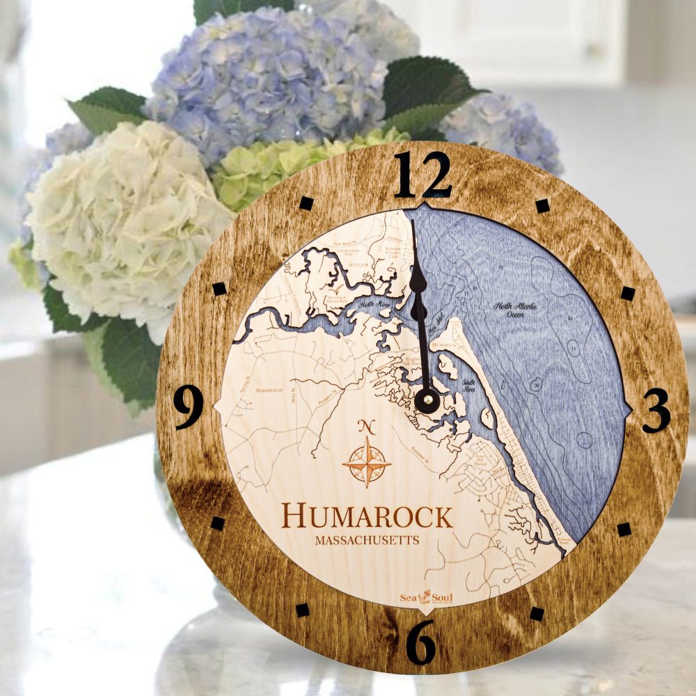 Humarock Nautical Clock Americana Accent with Deep Blue Water Sitting on Countertop by Flowers