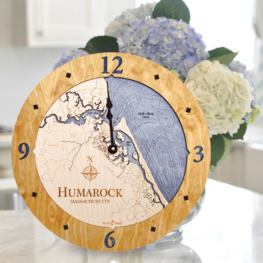 Humarock Nautical Clock Honey Accent with Deep Blue Water Sitting on Countertop by Flowers