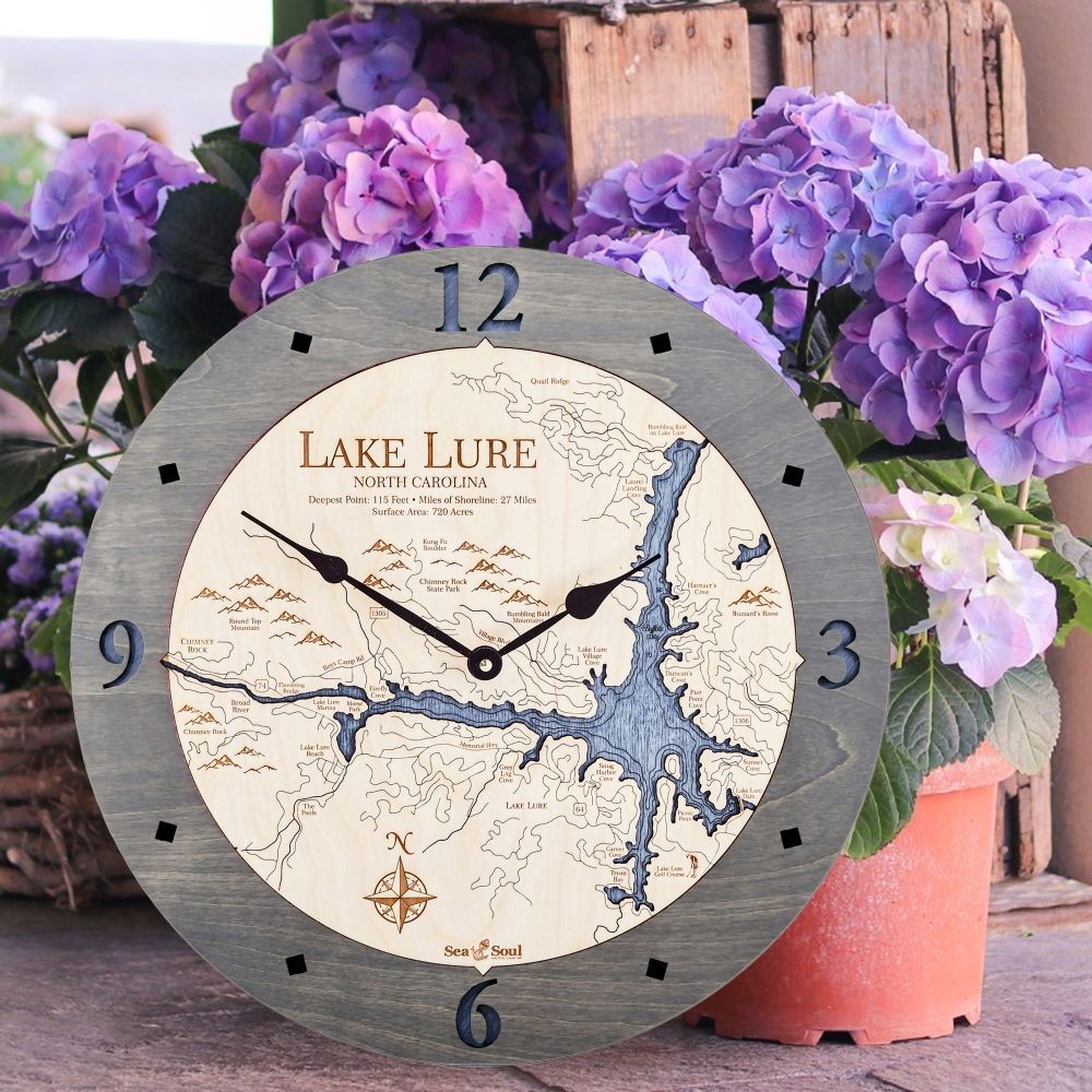 Lake Lure Nautical Clock Driftwood Accent with Deep Blue Water Sitting on Ground by Flower Pots