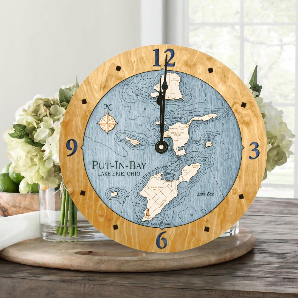 Put in Bay Nautical Clock Honey Accent with Deep Blue Water Sitting on Table with Flowers