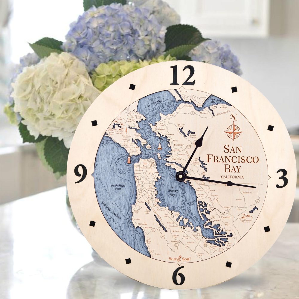 San Francisco Nautical Clock Birch Accent with Deep Blue Water Sitting on Countertop by Flowers
