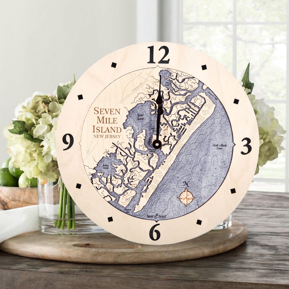 Seven Mile Island Nautical Clock Birch Accent with Deep Blue Water Sitting on Table with Flowers