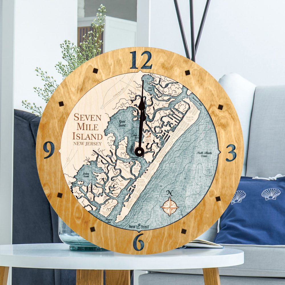 Seven Mile Island Nautical Clock Honey Accent with Blue Green Water Sitting on Coffee Table by Armchair