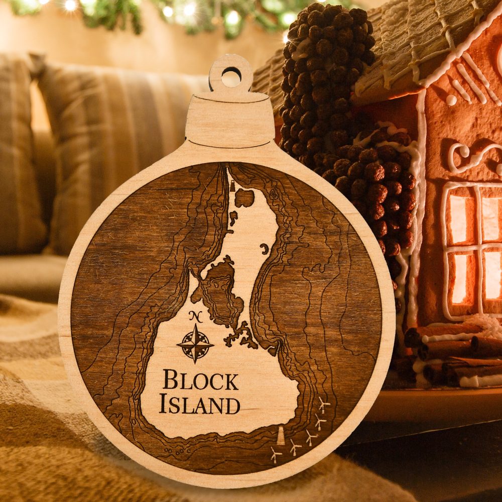 Block Island Engraved Ornament Sitting by Gingerbread House on Table