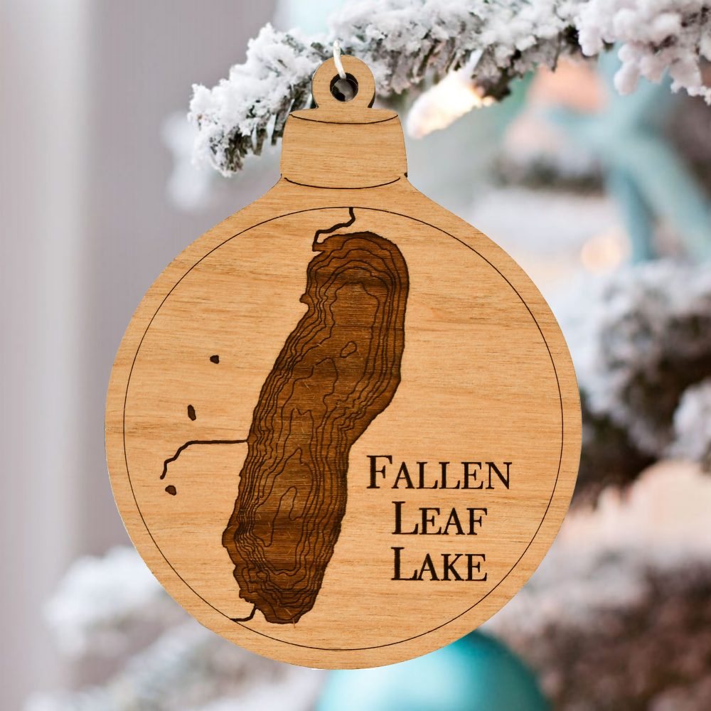 Fallen Leaf Lake Engraved Ornament Hanging on Pine Tree Outdoors with Snow